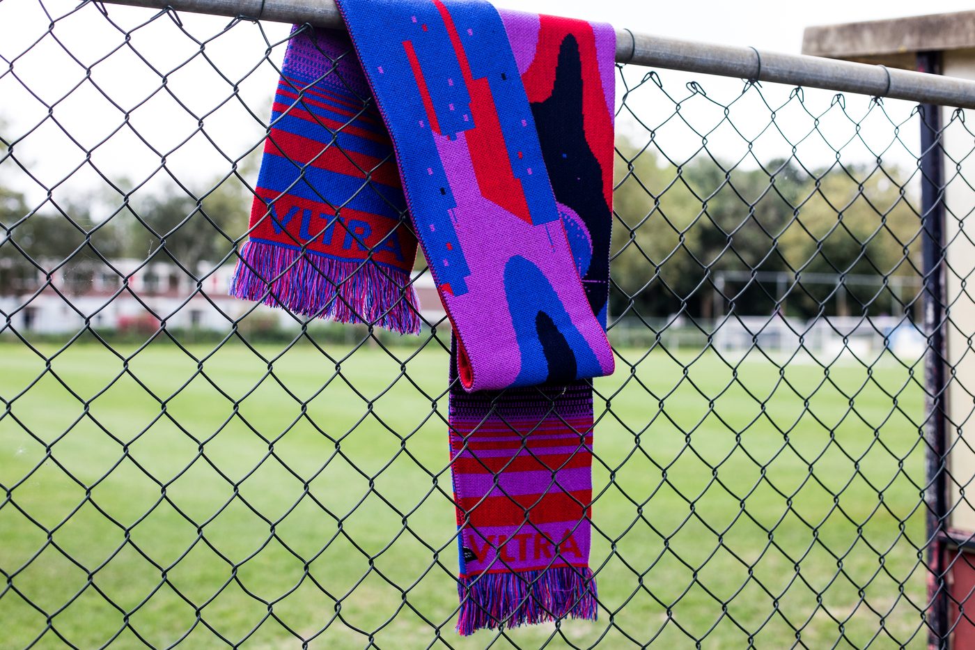 A League Extraordinaire scarf on a fence, 2019